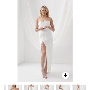 New- AU 08/ US 04 sized white dress. Great body hugging material